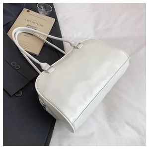 Minimalist white faux leather shoulder bag with smooth texture and zipper detail