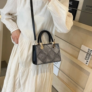 Minimalist grey quilted square crossbody bag with woven handle for women