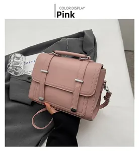 Pink lychee-patterned leather envelope bag with silver buckle and top handle details