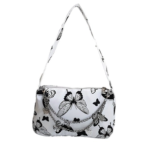 White canvas underarm bag featuring black butterfly patterns and double metal chains
