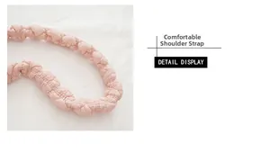Detail view of pink quilted shoulder strap with soft ruffled fabric texture and padding