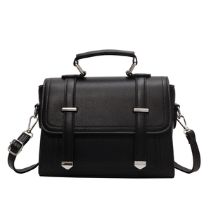 Minimalist black lychee pattern PU leather crossbody handbag with top handle and silver buckle