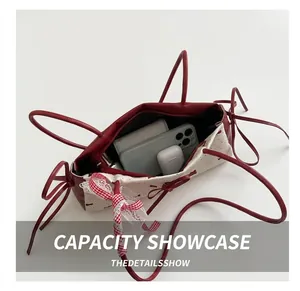 Interior view of the polka dot shoulder bag showing capacity for phone and wallet