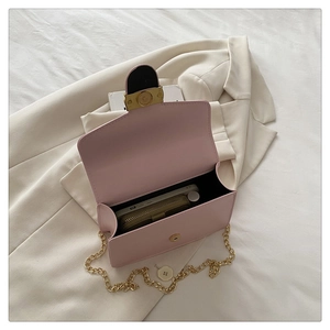 Internal view of pink crossbody bag showing capacity for phone and long wallet