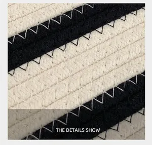 Detail of woven cotton rope texture with black and white stripes and zigzag stitching