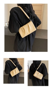 Detail of pleated cloud shoulder bag in beige PU leather with thick matching strap