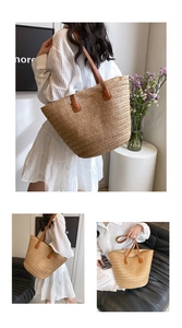 Detailed macro view of large capacity straw woven tote bag with brown leather shoulder straps