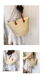 Close-up of woven texture and brown leather straps on large straw tote bag