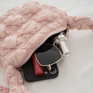 Pink quilted bubble puff shoulder bag with soft textured cloud design and zipper closure