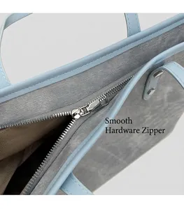 Detail of silver metal zipper and brown wavy lining on stylish tote bag