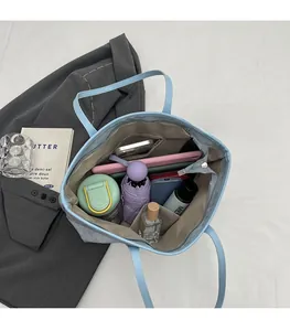 Top view of blue tote bag interior with zipper pocket showing spacious large capacity