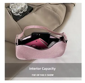 Internal capacity of pink sparkling shoulder bag showing space for phone and wallet