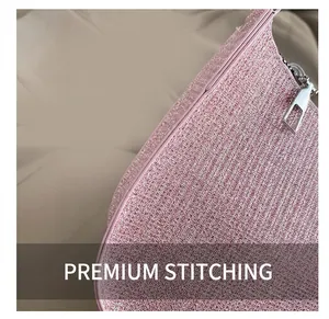 Close-up of pink glitter fabric texture and premium silver zipper on the shoulder bag