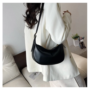 Detail shot of the black PU leather hobo bag showing adjustable strap and gold metal buckle