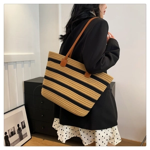 Detail of the large capacity woven cotton rope tote bag with chic black and beige stripes