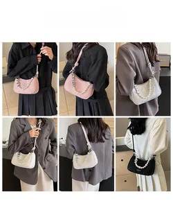 Hobo bag featuring pearl and silver heart chain detail shown in various model styles