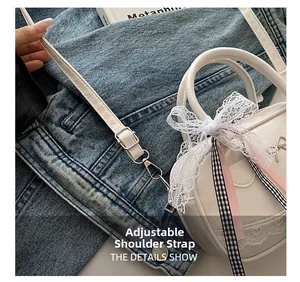 Detail shot of the adjustable shoulder strap on the white lace bow bowling bag