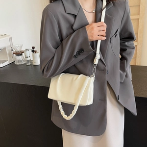 Minimalist white pleated crossbody bag with chain detail and adjustable strap for women