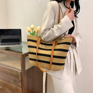 Woven striped cotton rope tote bag with brown straps and large capacity for beach or commute