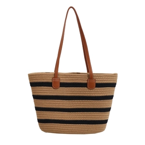 Striped cotton rope woven tote bag with brown leather handles and spacious interior