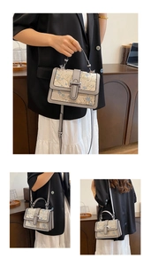 Detail of floral jacquard bag with silver rotating clasp and grey synthetic leather trim