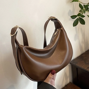 Brown PU leather hobo bag with adjustable wide shoulder strap in crescent dumpling shape
