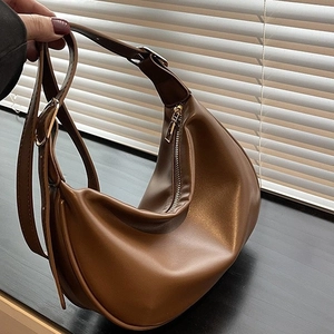 Caramel PU leather crescent moon hobo bag with wide adjustable strap and zipper closure