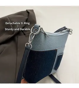 Detail der blauen Denim-Patchwork-Schultertasche mit Metallverschluss und Nähten
