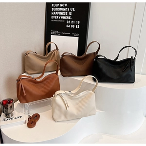 Group view of pleated large capacity tote bags in five colors with detachable straps