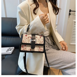 Detailed view of New Chinese style square bag with floral embroidery and metal buckle