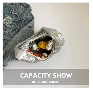 Spacious interior of silver quilted cloud bag showing large capacity for essentials