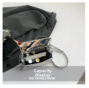 Detail view of the silver metallic bag interior showing capacity for cosmetics and phone