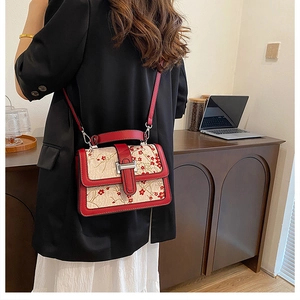 Chic retro handbag featuring red plum embroidery and polished silver metallic lock