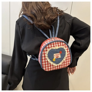 Rear view of a red and white gingham mini backpack with blue heart denim and lace detail