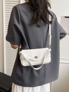 Elegant white leather crossbody bag with golden metal twist lock and dual strap options