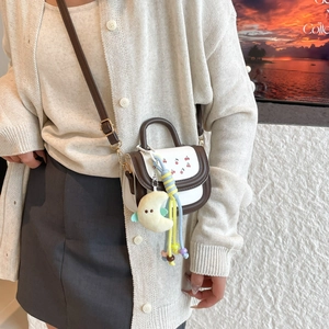 Mini handbag with cherry print and plush moon charm for summer fashion style
