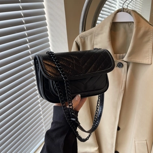 Minimalist black V-quilted chain crossbody bag with sleek polished leather finish