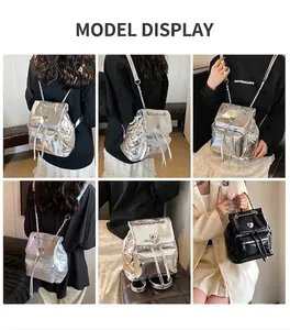 Close-up of quilted metallic silver backpack with chain straps and heart turn-lock