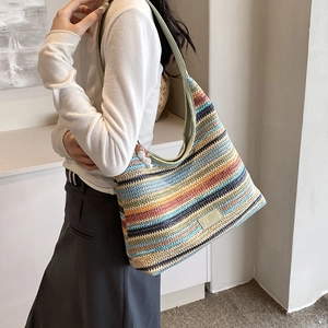 Colorful rainbow woven crochet tote bag with striped pattern and bohemian beaded strap charm