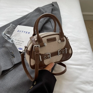 Chic retro top-handle crossbody bag in brown leather and beige canvas with metal buckles