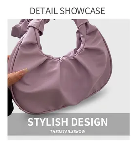 Detail showing soft pleated texture and lavender matte leather finish on hobo shoulder bag