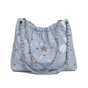 Quilted light blue tote bag with rhinestone star and metallic chain strap for women