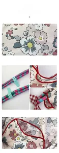 Detail of floral canvas tote fabric with red piping and a mint green cord adjuster