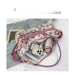 Floral canvas tote interior showing large capacity for umbrella, tablet and phone