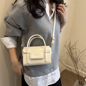 Japanese style cream PU leather handbag with adjustable strap for women in 2025 fashion