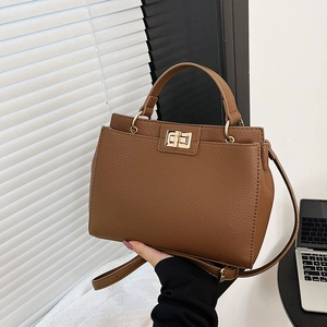 Brown litchi leather tote bag with gold twist lock for casual daily office use