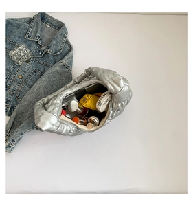 Top view of silver pleated bubble bag showing spacious interior with daily essentials