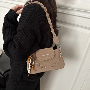 Vintage brown PU leather baguette bag with braided strap and floral chain detail