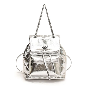 Silver quilted metallic backpack featuring a heart-shaped lock and chain straps