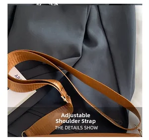 Detailed macro view of adjustable high-density woven strap with silver metal buckle on bag
